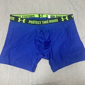 Under Armour compression shorts. Blue with black and green waist band. Size 2XL